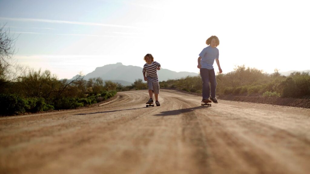 two young boys skateboarding
